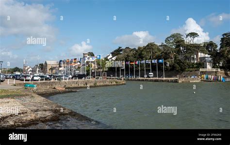 Rows of United Nations member states flags in front of Atlantic sea in ...