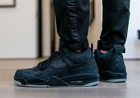 Jordan 4 KAWS Black Release Info | SneakerNews.com