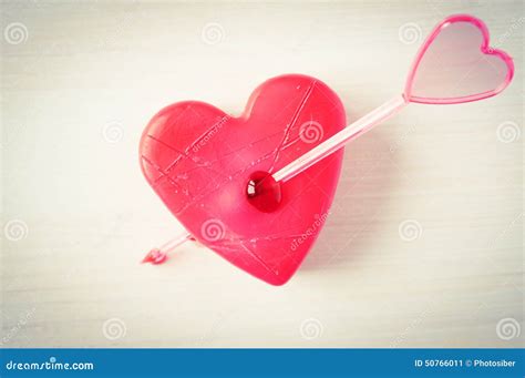 Heart pierced by an arrow stock image. Image of romantic - 50766011