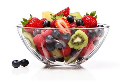 Premium AI Image | Glass bowl with fresh fruits salad and berries ...