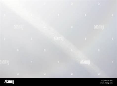 Halo a rainbow around the sun in the afternoon before the weather worsens Stock Photo - Alamy