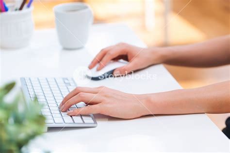 Person typing at on her office computer keyboard Royalty-Free Stock ...