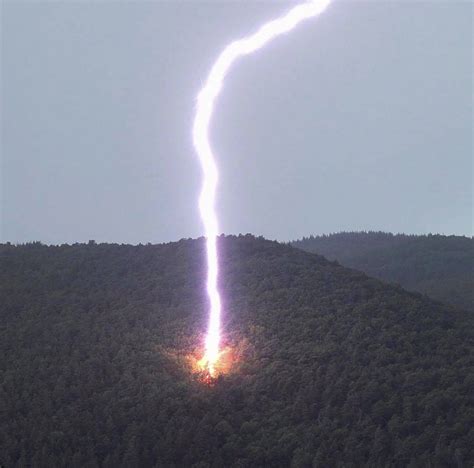 Hiker captures moment huge lightning bolt strikes mountainside