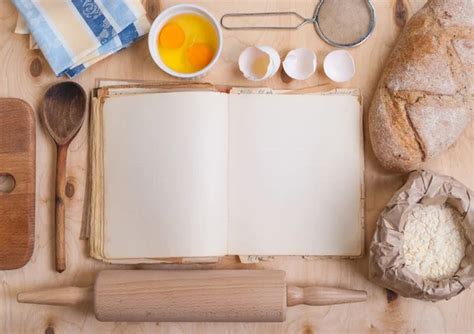 Baking background with blank cook book, eggshell, flour, rolling ...