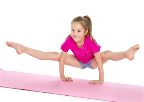 The Gymnast Perform an Acrobatic Element on the Floor. Stock Image ...