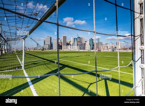 Brooklyn Bridge Park, volleyball court on Pier 6, View to Manhattan downtown in New York City ...