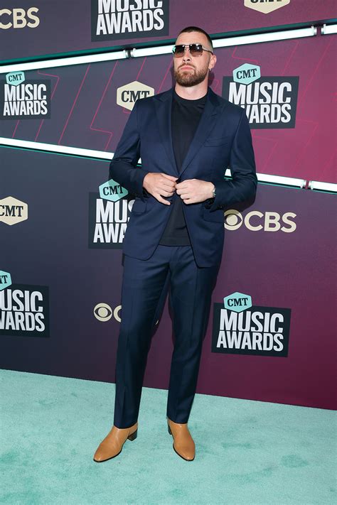 Travis Kelce Soars in Heeled Boots & Navy Suit at CMT Awards 2023 ...