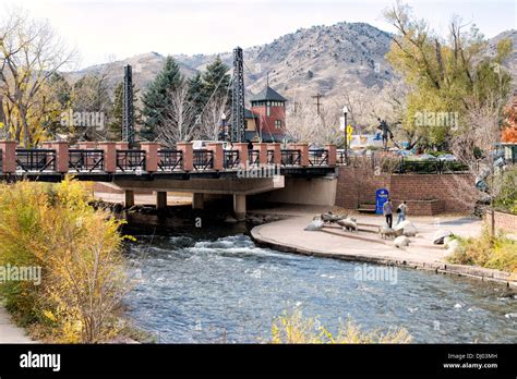 GOLDEN, Colorado - A bridge spans Clear Creek in Golden, Colorado, just ...