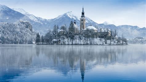 View of church on island on Lake Bled in winter, Slovenia | Windows ...