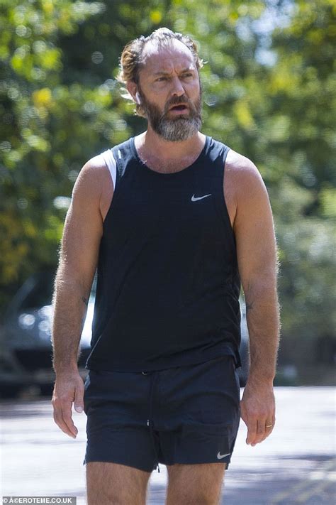 Jude Law showcases his rugged look during a low-key jog in London ...