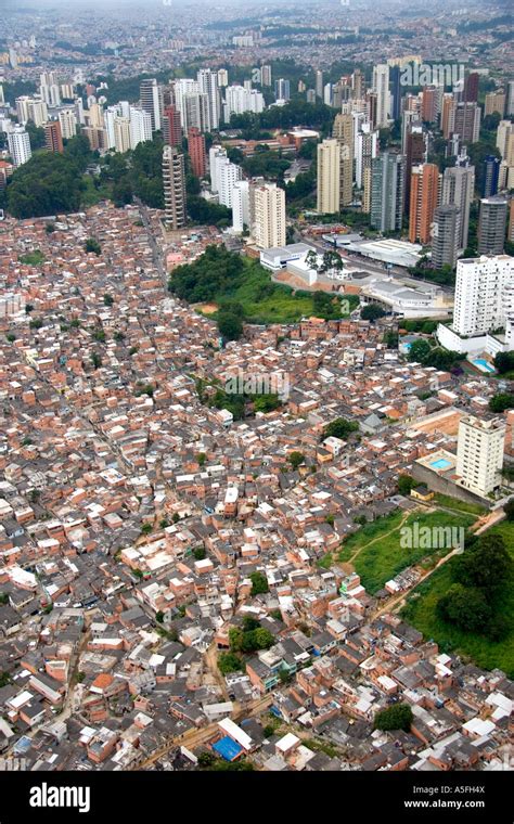 Aerial view of crowded favela housing contrasts with modern apartment Stock Photo, Royalty Free ...