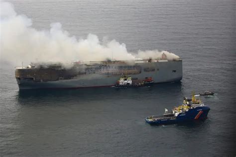 Japanese owner of car carrier ship that caught fire to investigate cause