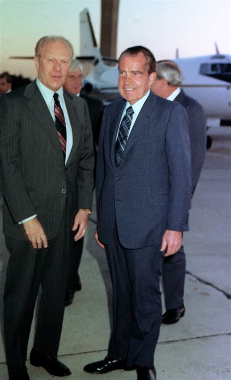 Former Presidents Gerald Ford and Richard Nixon chatting with each other shortly before they ...