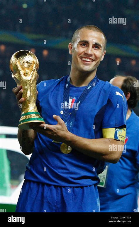 Italy team captain Fabio Cannavaro holds the World Cup trophy after ...