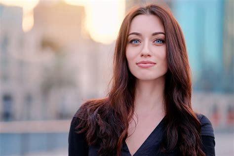 Close-up portrait of beautiful caucasian woman with charming smile and ...