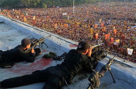 Catholics Worship Jesus of the Black Nazarene Statue in Manila