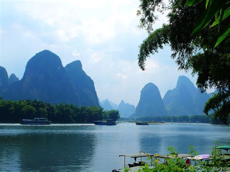 Yangshuo County in Guilin, Guanxi Province. Surrounded by its karst mountains and bordering on ...