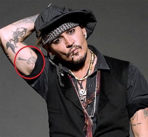 Johnny Depp Tattoos and the hidden meaning behind them