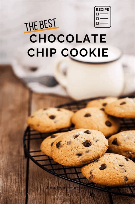 chocolate chip cookies cooling on a wire rack next to a cup of coffee ...