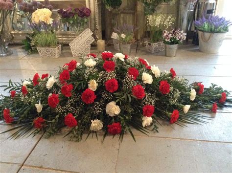 Red and white carnation coffin spray, casket spray, funeral spray… | Funeral flowers, Funeral ...