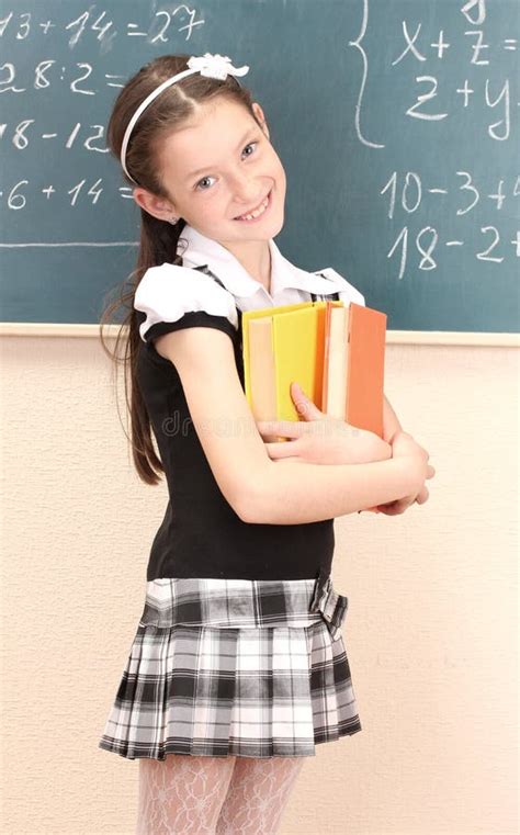 Beautiful Girl in School Uniform with Books Stock Photo - Image of ...