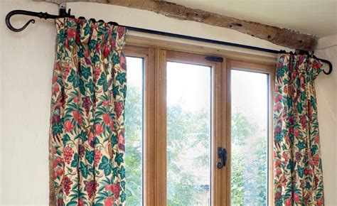 How to put up a curtain pole | Real Homes