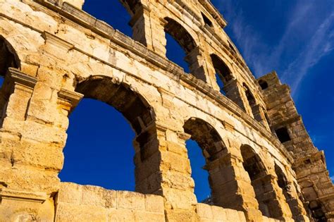 Premium Photo | Walls of the ancient roman amphitheater against the ...