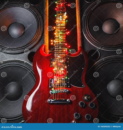 Electric Guitar with Festive Christmas Lights and Music Speakers Stock ...