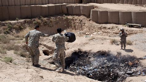 What Are Burn Pits, and How Did They Harm U.S. Troops? - The New York Times