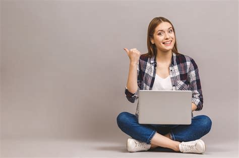 Premium Photo | Happy smiling woman working on laptop computer while ...