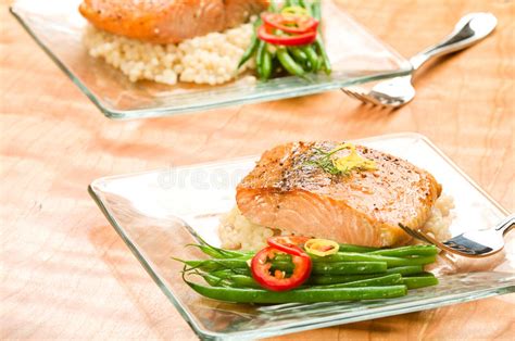 Salmon with Lemon Couscous stock photo. Image of seafood - 12424492