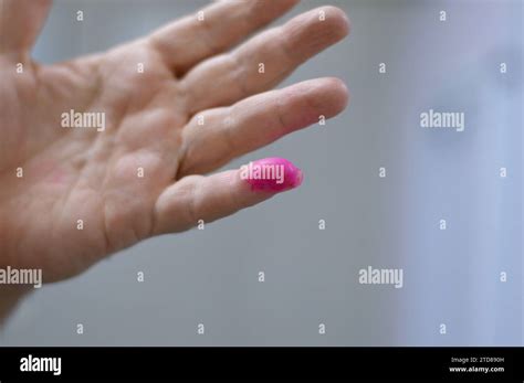 Cairo, Egypt, December 12 2023: A voter hand stained with election ink ...