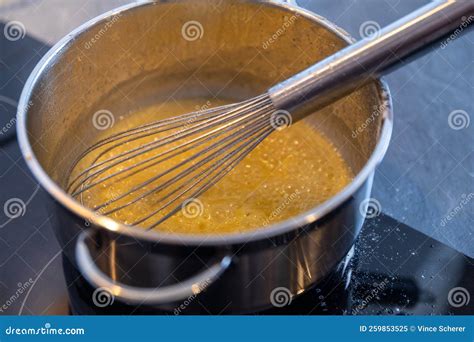 Melting Butter in a Stainless Steel Saucepan on the Black Stove ...