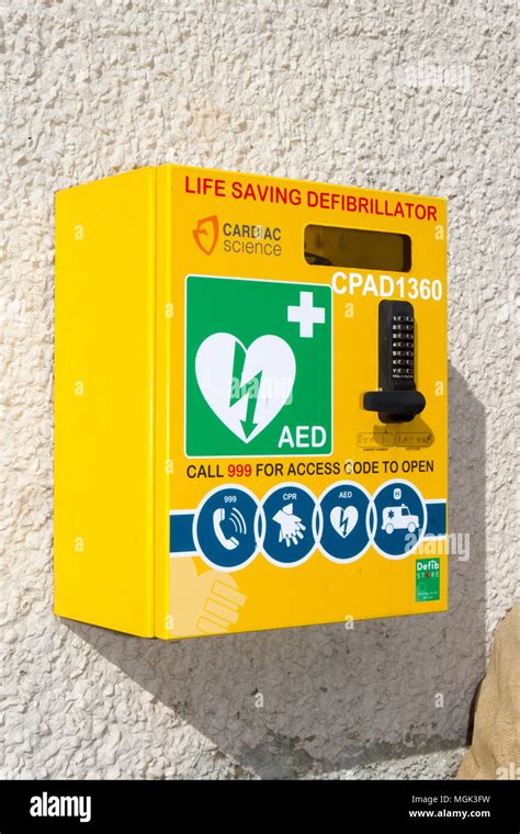 A wall mounted heart defibrillator for emergency resuscitation of a ...