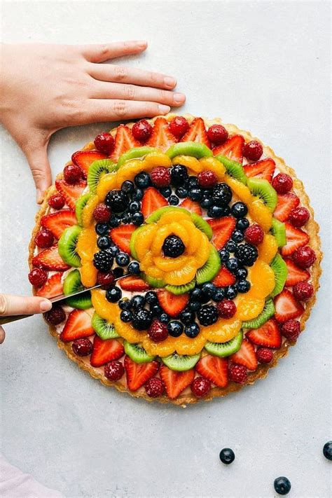 A twist on the famous "Fruit Pizzas" -- this one made in a tart pan with a sugar cookie crust ...