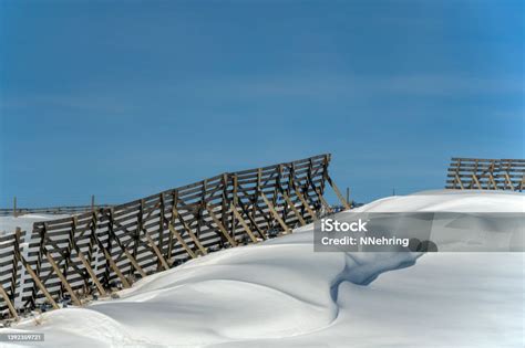 Snow Fence With Downwind Snow Drift Stock Photo - Download Image Now ...