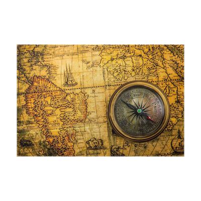 Poster Vintage compass lies on an ancient world map - PIXERS.UK