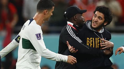 Steward grabs pitch invader inches from teary Cristiano Ronaldo after ...