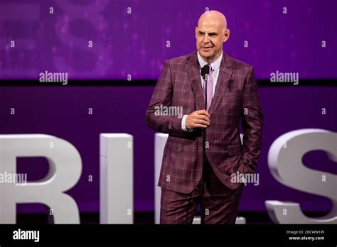 Harlan Coben poses on the stage at the Canneseries Awards ceremony ...