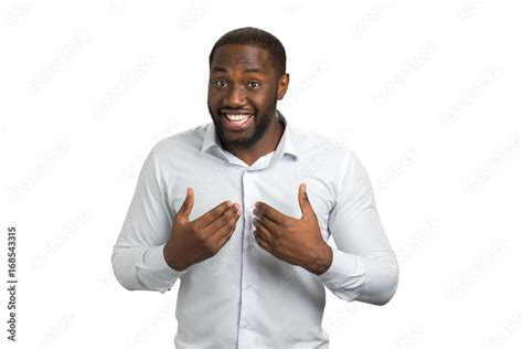 Smiling man pointing at himself with two hands. Afro american man in ...