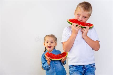 Kids eating watermelon stock image. Image of board, food - 105636039