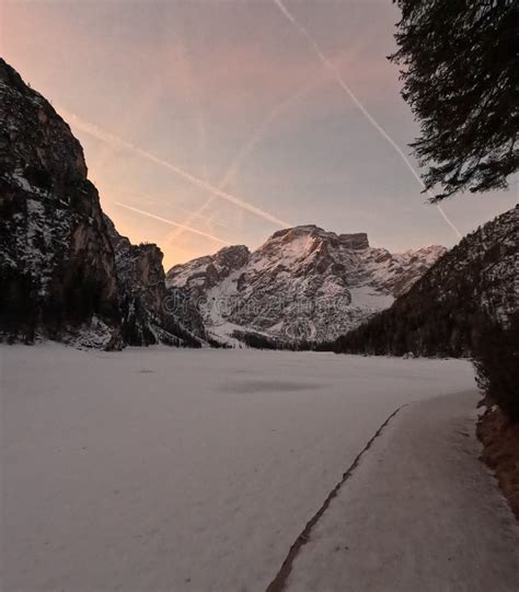 Winter Landscape View with Frozen Pragser Wildsee Lake at Sunrise, Clear and Purple Sky ...