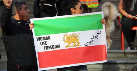 Protesters Holding the Flag of Iran · Free Stock Photo