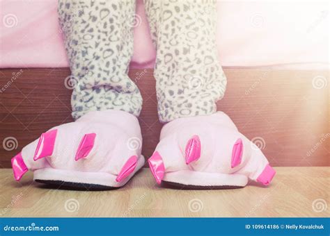 Female Legs in Cute Pink Monster Foot Slippers Stock Photo - Image of ...