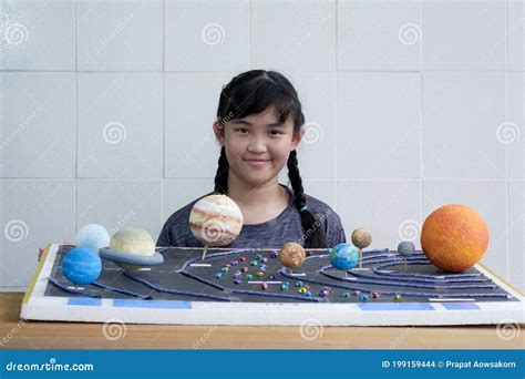 Asian Girl Showing Her Homemade Solar System Model for Science Homework ...