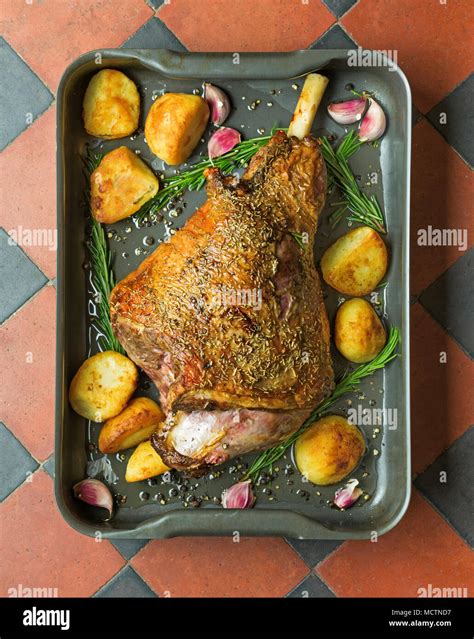 Roast leg of lamb with rosemary Stock Photo - Alamy