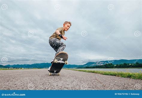 Young Skateboarder Make a Tricks with Skateboard Stock Photo - Image of people, healthy: 95675196