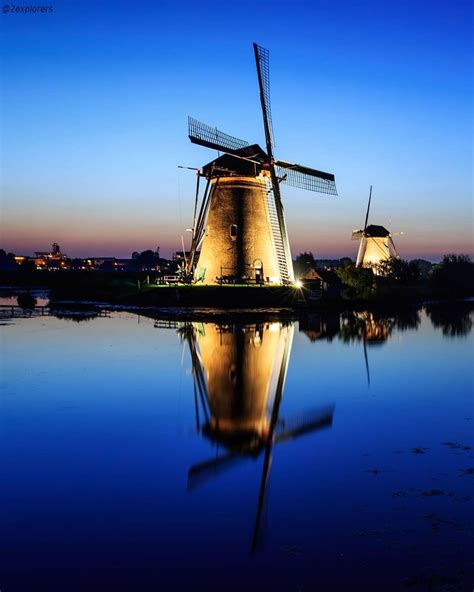 The windmills at night at Kinderdijk, Netherlands. It's easy to fall in love with this 18th ...