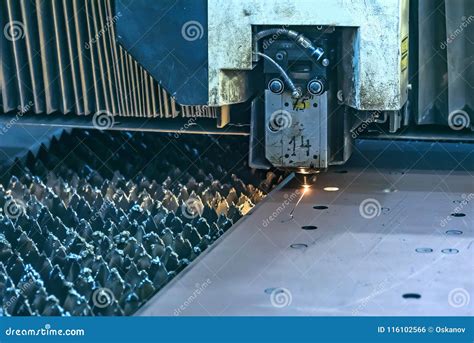 Laser beam cutting machine stock photo. Image of fire - 116102566