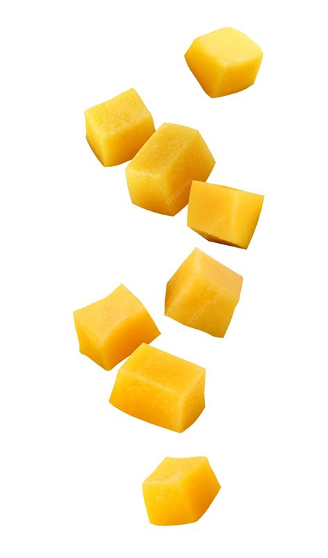 Premium Photo | Falling mangoes isolated on a white background with a clipping path. cubes of ...